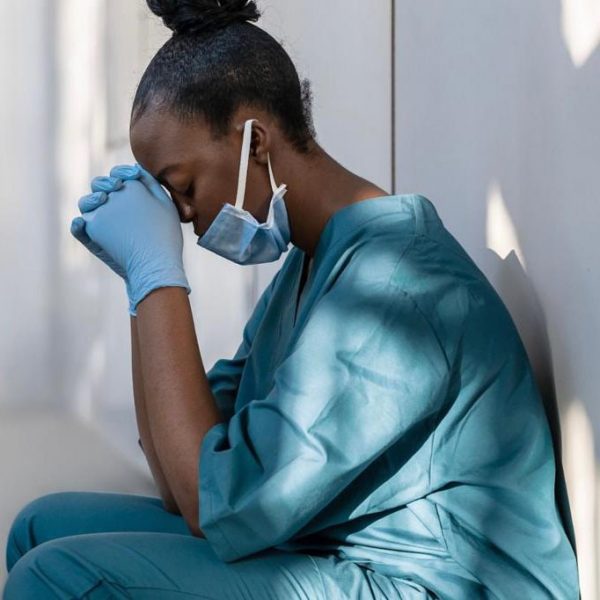 healthcare-worker-resting-head-down