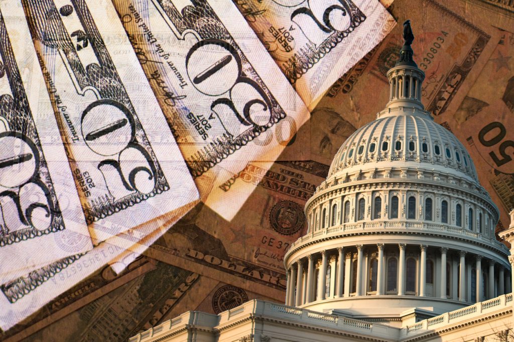 The Capitol Building against a backgound of 50 dollar bills.